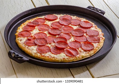 Pepperoni Pizza On A Cast Iron Pan