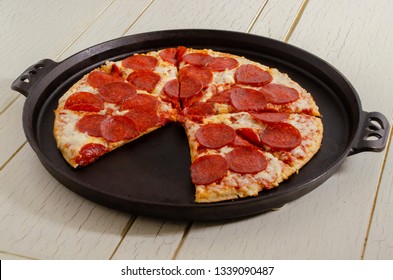 Pepperoni Pizza On A Cast Iron Pan