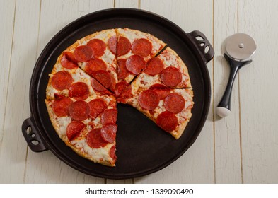 Pepperoni Pizza On A Cast Iron Pan