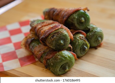 Jalapeño Peppers Stuffed With Cheese And Wrapped In Bacon