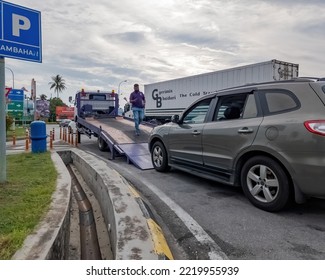 Perak, Malaysia - Aug 7, 2022 : Setting Up The Broken Car Going On The Truck For Transportation.