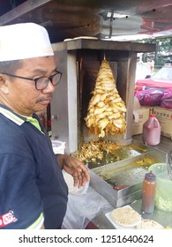 Perak, Malaysia. December 6,2018: Malay Hawker Preparing Kebab Burger At His Stall At Kg Koh Thursday Market.