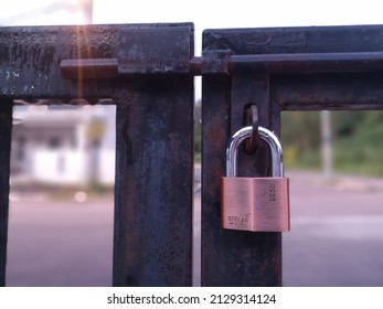 Perak, Malaysia - February 2022 : Padlock On Gate With Depth Of Field Camera Effect. 