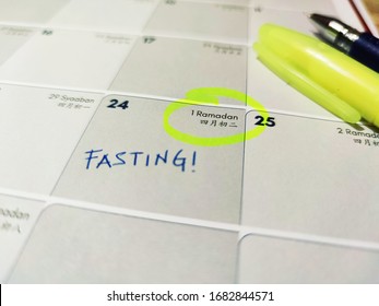 PERAK, MALAYSIA, MAR 10, 2020: Highlight and mark fasting on 1st Ramadan on the calendar with yellow highlighter as a reminder. 