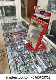 Perak,Malaysia. April 23, 2021: The Viewing Mirrors Stand Found On The Customer Sitting Front Glass Table At The NamYoung Optical Checkup Shop,Kampong Koh.