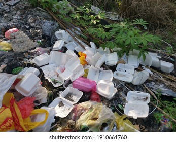 Perak,Malaysia. February 6,2021: 
Environmental pollution where irresponsible people throw assortment of garbage dumps in the isolated field along the roadside at the Kg Koh Plantation.