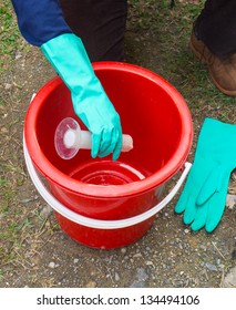 PERAK,MALAYSIA- MAC 23 :Environmental Health Worker Mixes Poison For Malaria Mosquito Net On March 23,2013 In Perak.Poison Mosquito Net Is One Of Malaria Preventive Method.