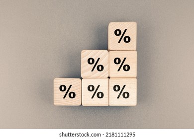 Percent icon on stack of wood cubes, percentage increase step by step, progressive percent calculation, percent ratio