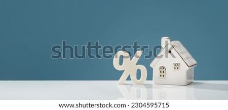 Percentage and house on white desk. mortgage calculator or real estate business concept banner. Listing. Down payment. Loan or insurance rate payments. Liability and risk