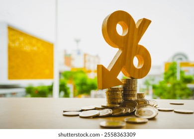 Percentage model, coin stack and down arrow, concepts for success, methods, systems of raising or lowering Fed interest rates to correct inflation concepts.