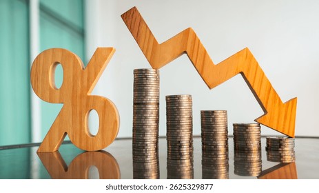 Percentage model, coin stack and down arrow, concepts for success, methods, systems of raising or lowering Fed interest rates to correct inflation concepts.