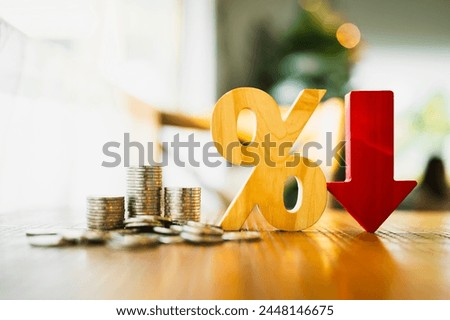 Percentage model, coin stack and down arrow, concepts for success, methods, systems of raising or lowering Fed interest rates to correct inflation concepts.