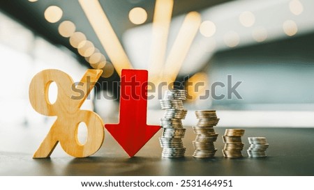 Percentage model, coin stack and down arrow, concepts for success, methods, systems of raising or lowering Fed interest rates to correct inflation concepts.