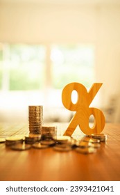 Percentage model with coins stack. Concepts of the banking system, rising interest rates, inflation, deflation, and savings.