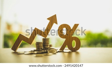 Percentage model with coins stack. Concepts of the banking system, rising interest rates, inflation, deflation, and savings.
