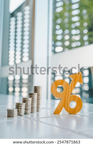 Percentage model with coins stack. Concepts of the banking system, rising interest rates, inflation, deflation, and savings.	