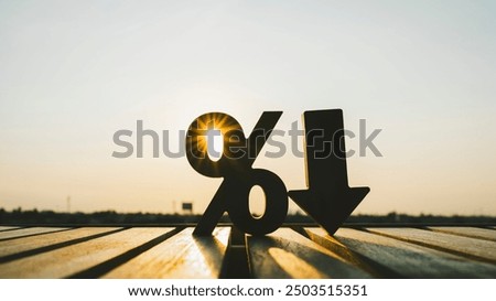 Percentage model and down arrow with evening sky. Key concepts for success, methods, systems of raising or lowering Fed interest rates to correct inflation concepts.