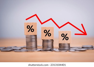 Percentage sign on wooden cubes with Stack of coin bar chart and red graph trending downwards on white background. Economy recession crisis, inflation, stagflation, business and financial loss concept - Powered by Shutterstock