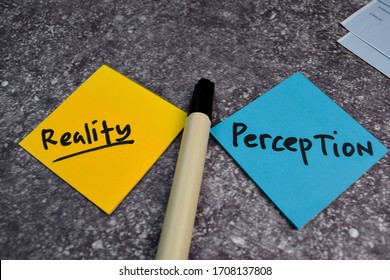 Perception Or Reality Write On A Sticky Note Isolated On The Table.