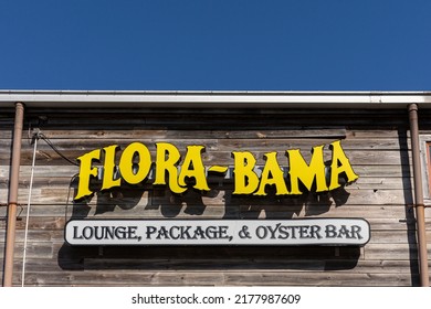 Perdido Key, FL - March 27, 2022: Sign Outside The Famous Flora-Bama Beach And Oyster Bar, A Well-known Landmark, Straddling The State Line Between Perdido Key, FL And Orange Beach, AL.