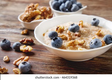 Perfect Breakfast. Oatmeal With Blueberries. Healthy Eating For The Whole Family. Wood Background.