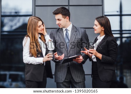 Perfect business relationship. Three confident and motivated business partners are discussing future business details!