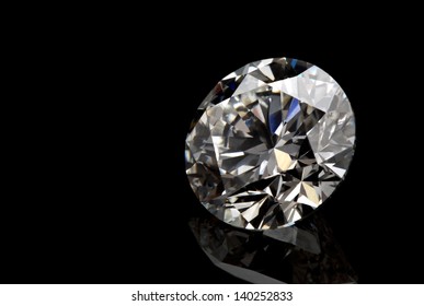 A perfect cut of diamond isolated on black background.