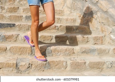 Perfect Female Legs In Summer Sandals Walking On A Resort City 