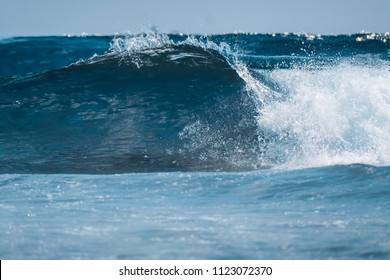 Perfect Glassy Wave Breaking On Shore