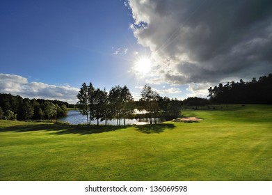 Perfect Green grass on a golf field - Shutterstock ID 136069598