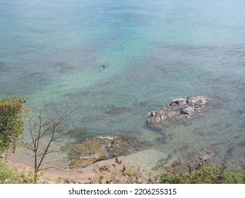 The Perfect Harmony Of Crystal Clear Water And Rocks.