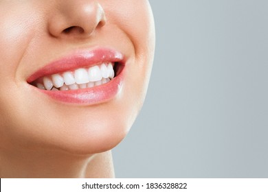 Perfect healthy teeth smile of a young woman. Teeth whitening. Dental clinic patient. Image symbolizes oral care dentistry, stomatology.