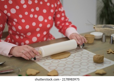 Perfect Housewife In Her Perfect Kitchen. A Woman In A Red Dress Prepares Cookies.