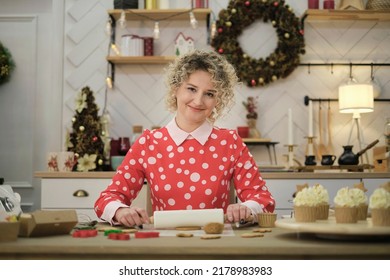 Perfect Housewife In Her Perfect Kitchen. A Woman In A Red Dress Prepares Cookies.