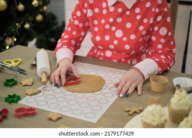 Perfect Housewife In Her Perfect Kitchen. A Woman In A Red Dress Prepares Cookies.