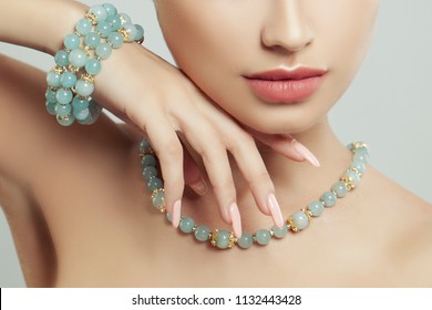 Perfect jewelry on female body, closeup portrait. Bracelet, necklace and manicure - Shutterstock ID 1132443428