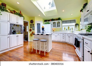 Perfect Kitchen With White Interior, Yellow Walls, And Glossy Hardwood Floor.