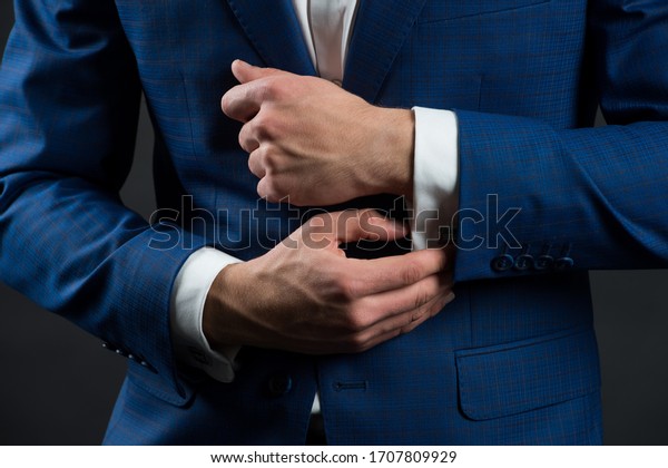 Perfect to last detail. Getting dressed. Formal
suit shirt and cuffs. Wearing formal style. Fashion and style.
Formal clothes. Dress code. Wedding ceremony. Holiday celebration.
Formal and classy.