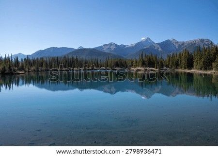 Perfect Mountain Reflection on Calm Waters of Forgetmenot Pond, Kananaskis, Alberta