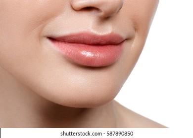 Perfect natural lip makeup. Close up macro photo with beautiful female mouth. Plump full lips. Beauty young woman Smile