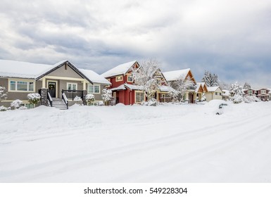 A Perfect Neighborhood. Houses In Suburb At Snow Winter In The North America.