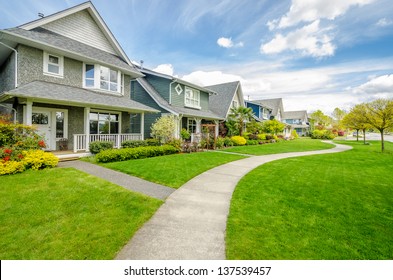 A perfect neighborhood. Houses in suburb at Spring in the north America - Shutterstock ID 137539457
