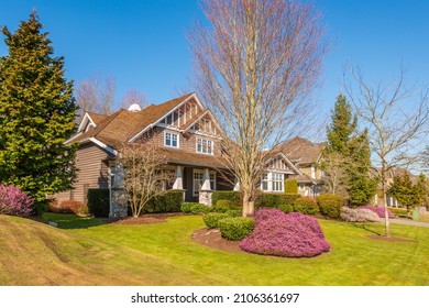 A perfect neighbourhood. Houses in suburb at Spring in the north America. Luxury houses with nice landscape.