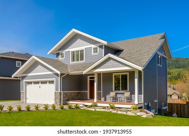 A perfect neighbourhood. Houses in suburb at Summer in the north America. Luxury houses with nice landscape. - Shutterstock ID 1937913955