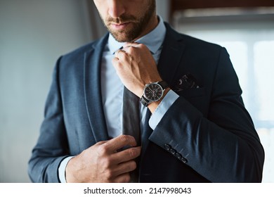 The perfect outfit means a perfect day. Shot of an unrecognizable man dressing himself at home. - Powered by Shutterstock