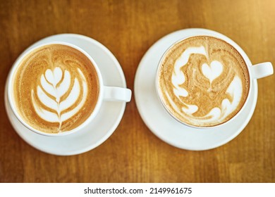 The Perfect Pair. Shot Of A Coffee Cup In A Cafe.