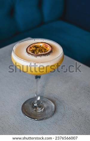 Perfect Pornstar Martini Cocktail with blue background
