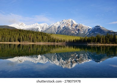Perfect reflection of Pyramid mountain in Pyramid Lake in Jasper National Park, Canada, UNESCO World Heritage site