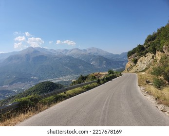 Perfect Road for a roadtrip - Street in the mountains: Amazing view into the valley near Ioannina. Northern Greece.