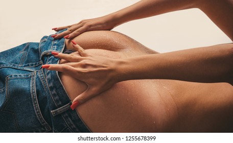 Perfect sexy butt. Ideal woman's butt and hips. Perfect anti-cellulite and skin care therapy program. Sexy butt with sensual touch. Women take jeans